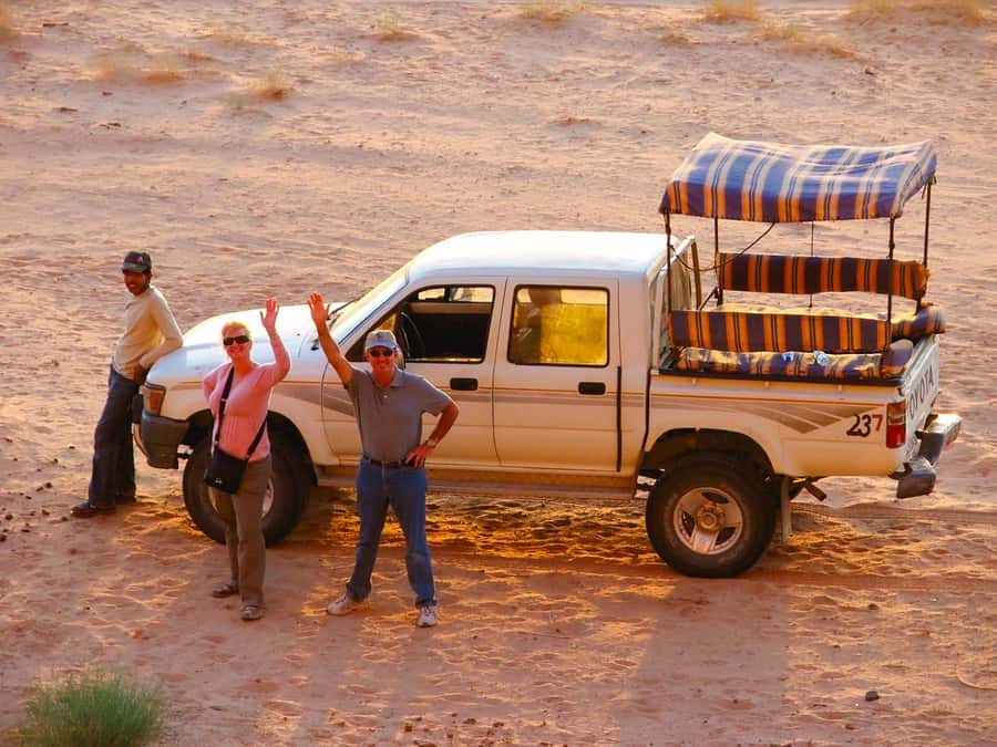 From Petra/Wadi Musa: Wadi Rum Jeep Tour with Hotel Transfer - Riding the open jeep through the Valley of the Moon