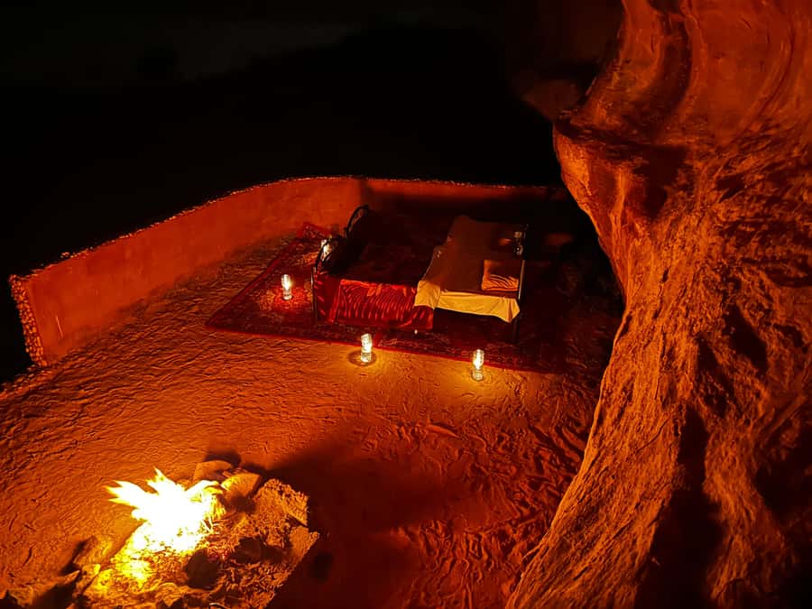 From Wadi Rum: Jeep Tour with Overnight Desert Camping - Riding through the red desert by open jeep