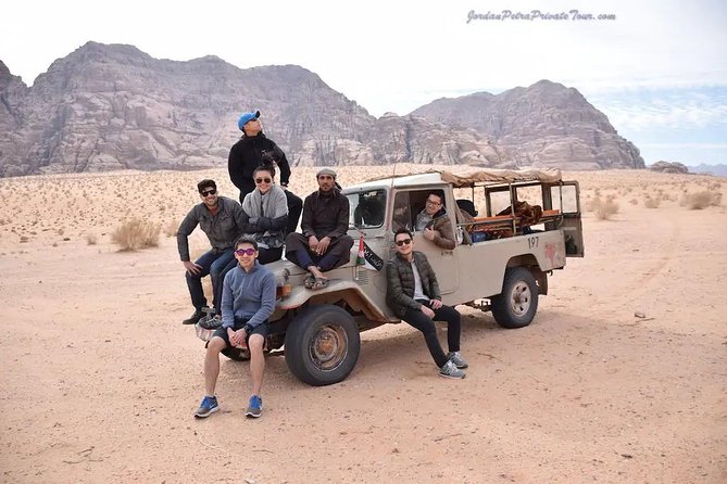 Jeep Tour in Wadi Rum with Professional Guide (Full day) - Riding across Wadi Rum in an open-backed jeep
