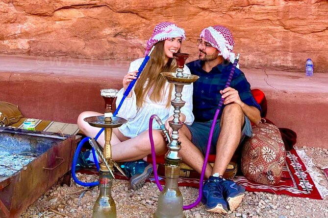 Wadi Rum Full Day Jeep Tour + Overnight & Dinner in Bedouin Camp - Burdah Rock Bridge from below
