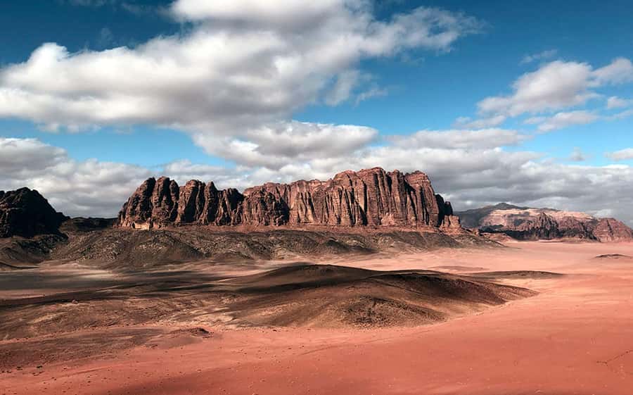 Wadi Rum:Full Day Tour Lunch Sand boarding Camel Ride Sunset - Umm Fruth Rock Arch and a five-minute climb